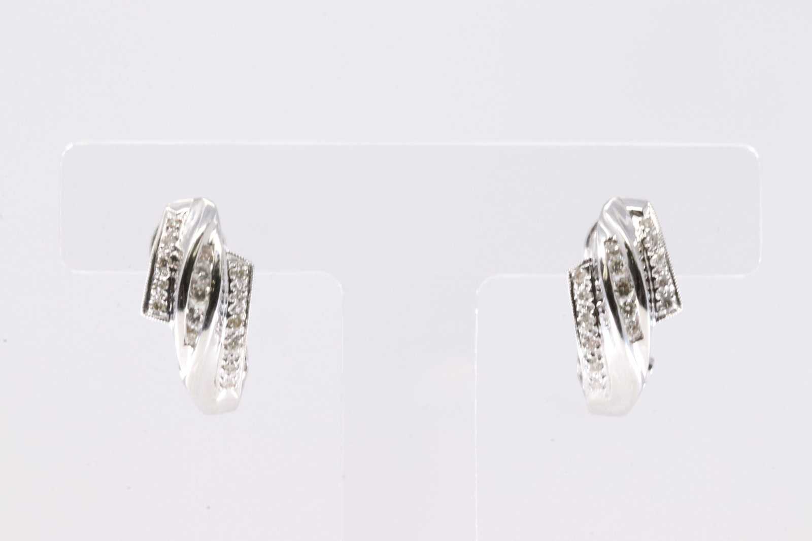 Diamond Hoop French Clip Earring 14Kt.: Ladies 14Kt White Gold Diamond Hoop French Clip Earring. This Charming Earring's has 16 Round Brilliant Diamonds. Total Weight: 5.12 Grams.