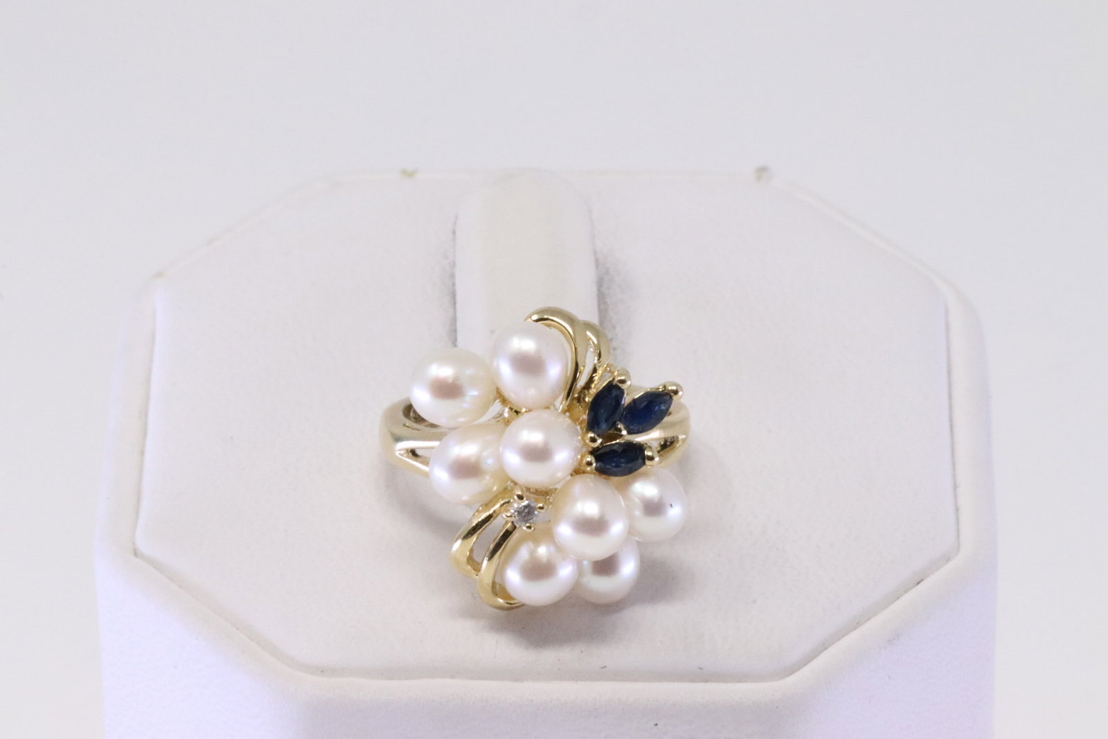 Pearl / Sapphire & Diamond Ring 14Kt.: Ladies 14Kt Yellow Gold Pearl / Sapphire & Diamond Ring. Ring has 8 Pearl with 3 Sapphire's & one Diamond. Ring size: 5.00. Total weight: 5.00 Grams.