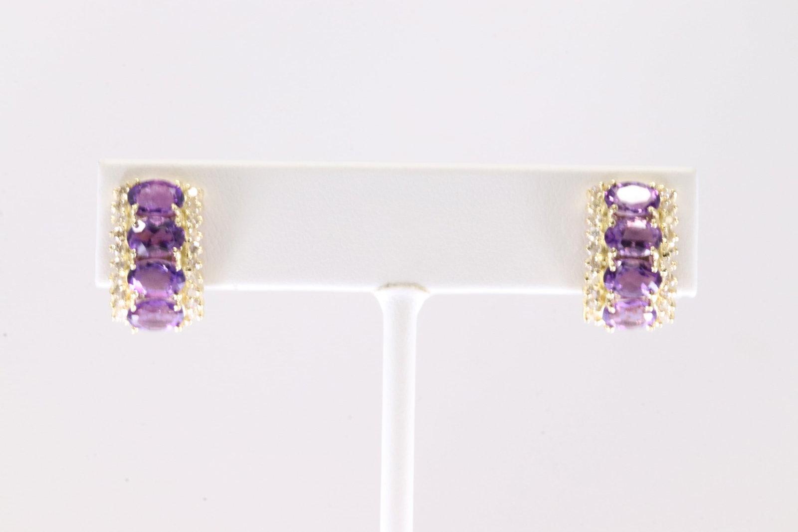 Elegant Amethyst & Diamond Hoop French Clip Earring 14Kt.: Ladies 14Kt Yellow Gold Amethys & Diamond Hoop French Clip Earring. This elegant hoop with french clip has 8 purple oval amethyst and 40 round sparkling diamonds. Total weight: 4.84 Grams.