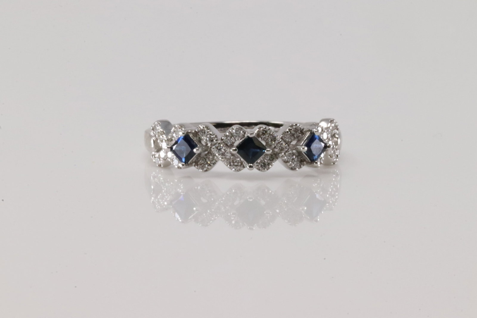 Sapphire & Diamond Ring 10Kt.: Ladies 10Kt White Gold Sapphire & Diamond Ring. This Elegant Ring has 3 Blue Sapphires with Sparkling Diamonds. Diamodns weight: 0.20ctw. Ring size: 7.00. Total weight: 2.60 Grams.
