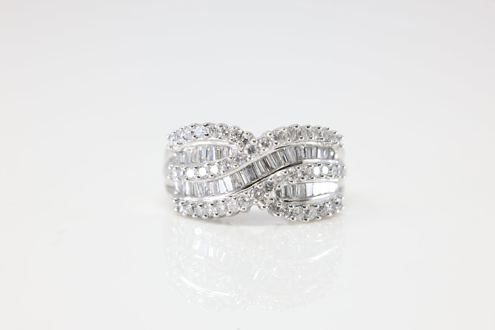 Diamond Ring 14Kt.: Ladies 14Kt White Gold Diamond Ring. This Gorgeous Ring has 88 Baguette / Round Diamonds. Diamond Weight Approx: 1.80 ctw Ring Size: 8.50. Total Weight: 7.60 Grams.
