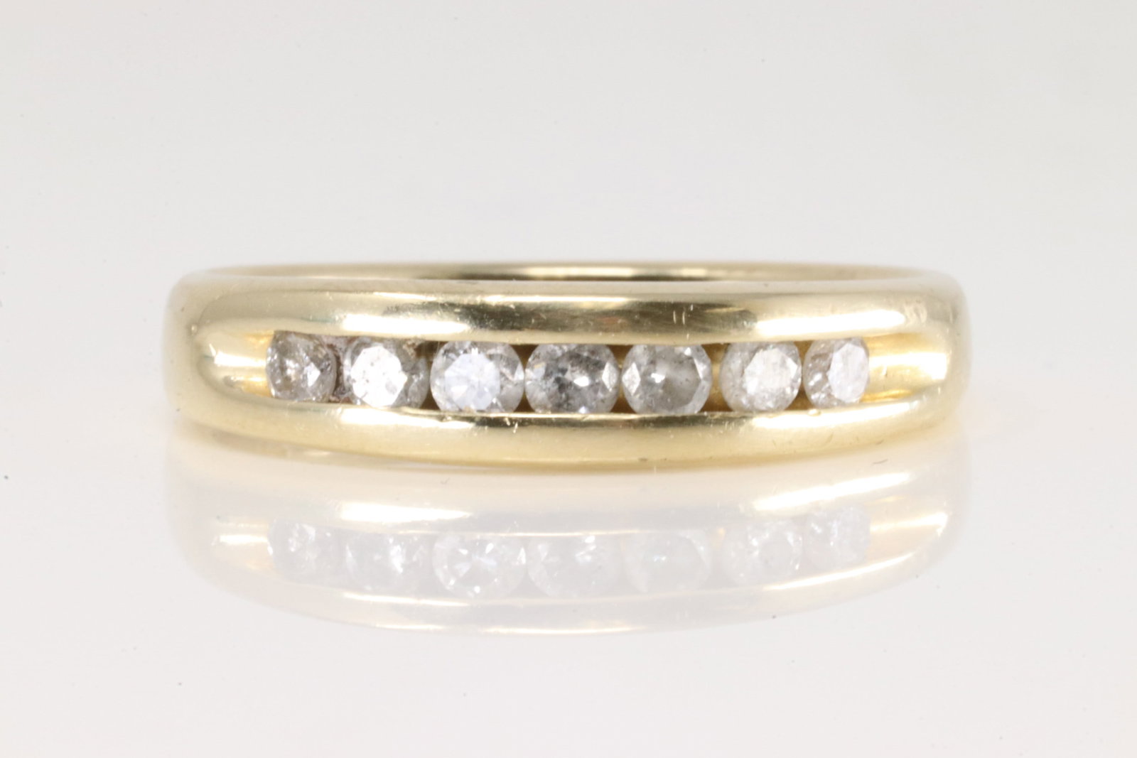 Wedding Diamond Ring 14Kt.: 14Kt Yellow Gold wedding D9iamond Ring. This wedding ring has 7 round diamonds. Diamonds weight approx: Ring size: 10.00. Total weight: 5.90 Grams.