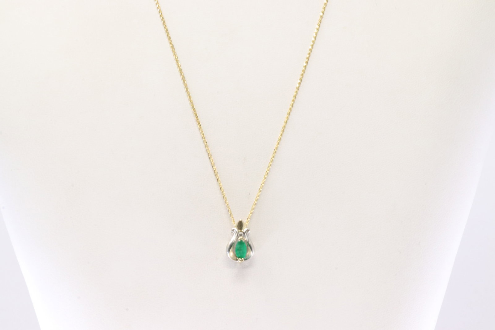 Emerald & Diamond Pendant / Necklace 14Kt.: 14Kt White & Yellow Gold Emerald & Diamond Pendant / Necklace. This Charming Pendant has Marquise & one round Diamond and 14K Necklace. Necklace length: 22.00" Total weight: 2.95 Grams.