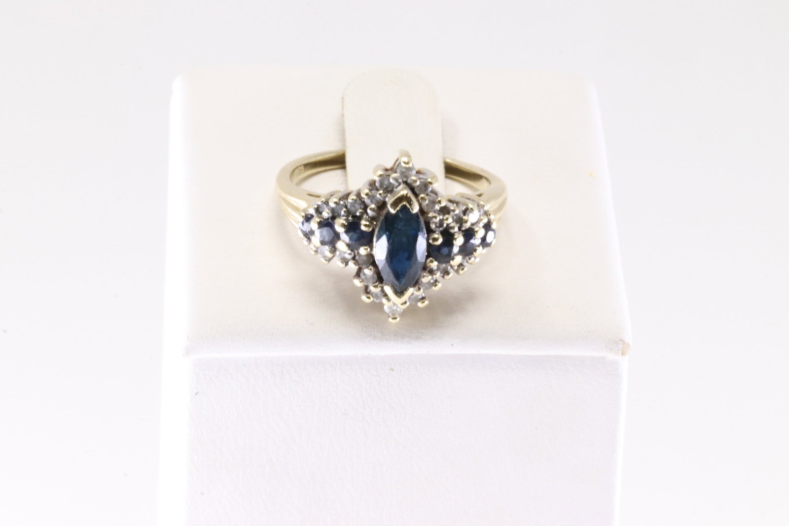 Sapphire & Diamond Ring 14Kt.: Ladies 14Kt Yellow Gold Sapphire & Diamond Ring. This Ring has 7 Blue Sapphire Gemstones & 24 Round Sparkling Diamonds. Ring Size: 6.75. Total Weight: 4.50 Grams.