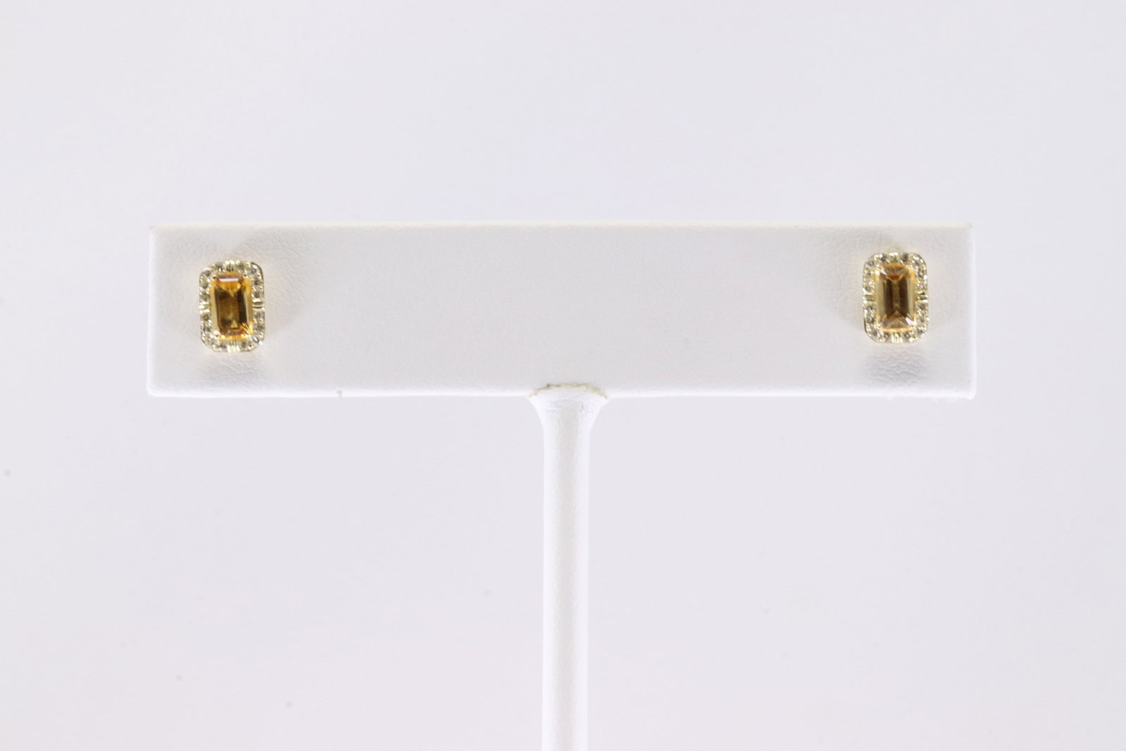Citrine & Diamond Stud Earring 10Kt.: Ladies 10Kt Yellow Gold Citrine & Diamond Stud Earring.This Charming Earring's has Yellow Citrine Stone with Sparkling Diamonds. Diamonds weight: 0.15ctw.