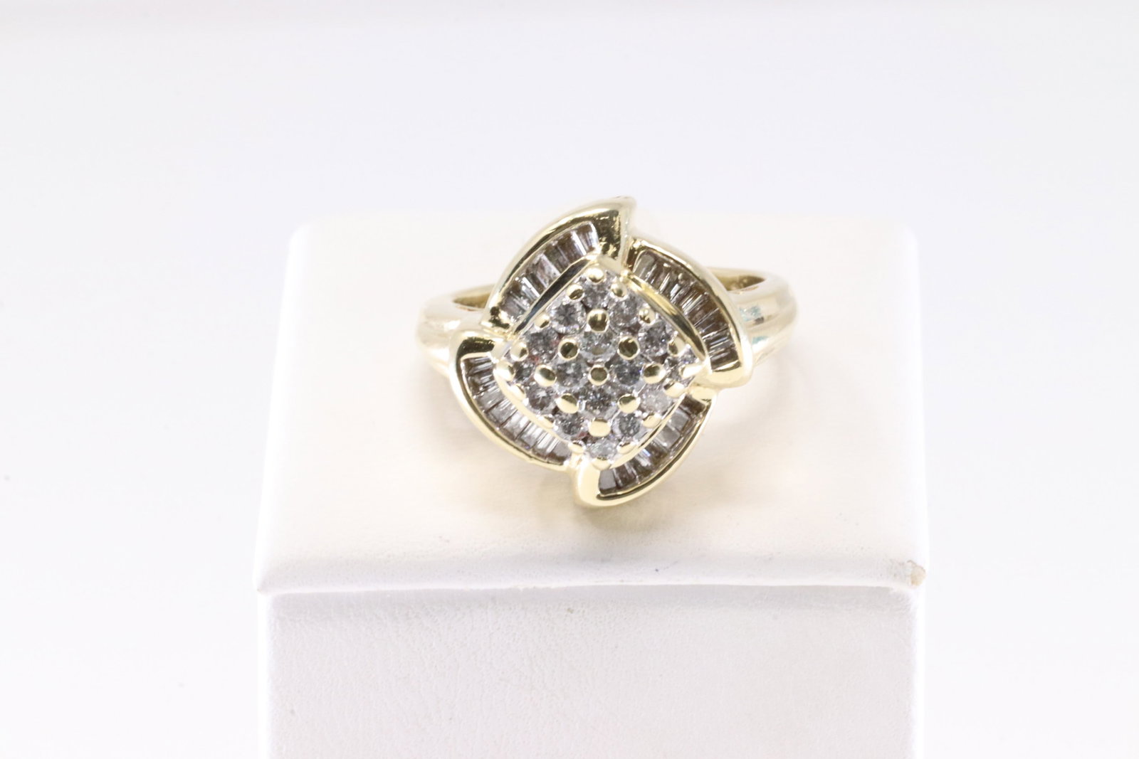 Diamond Ring 14Kt.: Ladies 14Kt Yellow Gold Diamond Ring. This Charming Ring has Brilliant Baguette / Round Sparkling Diamonds. Diamond Approx Weight: 0.85 ctw Ring Size: 8.00. Total Weight: 8.43 Grams.