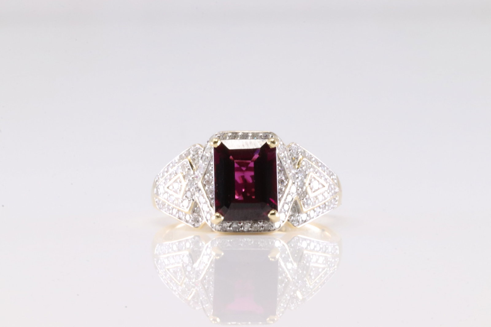 Garnet & Diamond Ring 14Kt.: Ladies 14Kt Yellow Gold Garnet & Diamond Ring. This Ring has Squared Garnet Gemstone With 98 Round Sparkling Diamonds. Diamond Weight Approx: 1.00 ctw Ring Size: 9.00. Total Weight: 5.20 Grams.