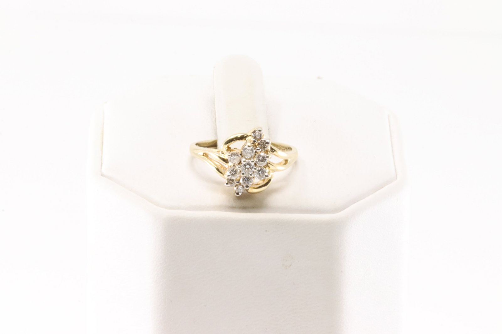 Diamond Ring 14Kt.: Ladies 14Kt Yellow Gold Diamond Ring. This charming ring has flower design with 11 sparkling diamonds. Diamonds weight approx: 0.25 ctw Ring size: 5.75. Total weight: 3.00 Grams.