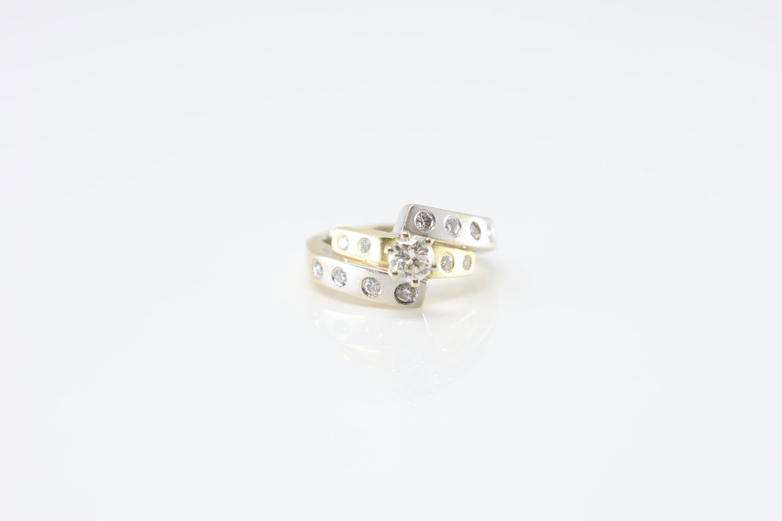 Engagement Diamond Ring 18Kt.: Ladies 18Kt White Gold Engagement Diamond Ring. This beautiful ring has bypass design with 2 tone gold and 15 sparkling round diamonds. Diamonds weight approx: 0.75ctw.Ring size: 5.25. Total weight: