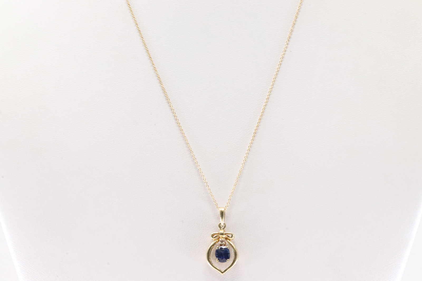 Sapphire & Diamond Pendant / Necklace14Kt.: 14Kt Yellow Gold Sapphire & Diamond Pendant / Necklace. This Charming pendant has Blue Sapphire with round Diamond and 14K Necklace. Necklace length: 18.00"
