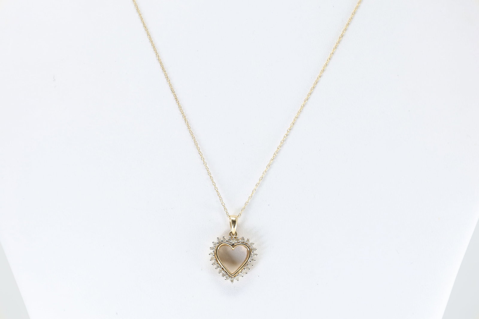 Diamond Heart Pendant / Necklace 10Kt.: 10Kt Yellow Gold Diamond Heart Pendant / Necklace. This 10K yellow chain has one pendant with a heart deisgn and 26 round diamonds. Diamonds weight approx: 0.50ctw. Necklace length: 18.00" Total
