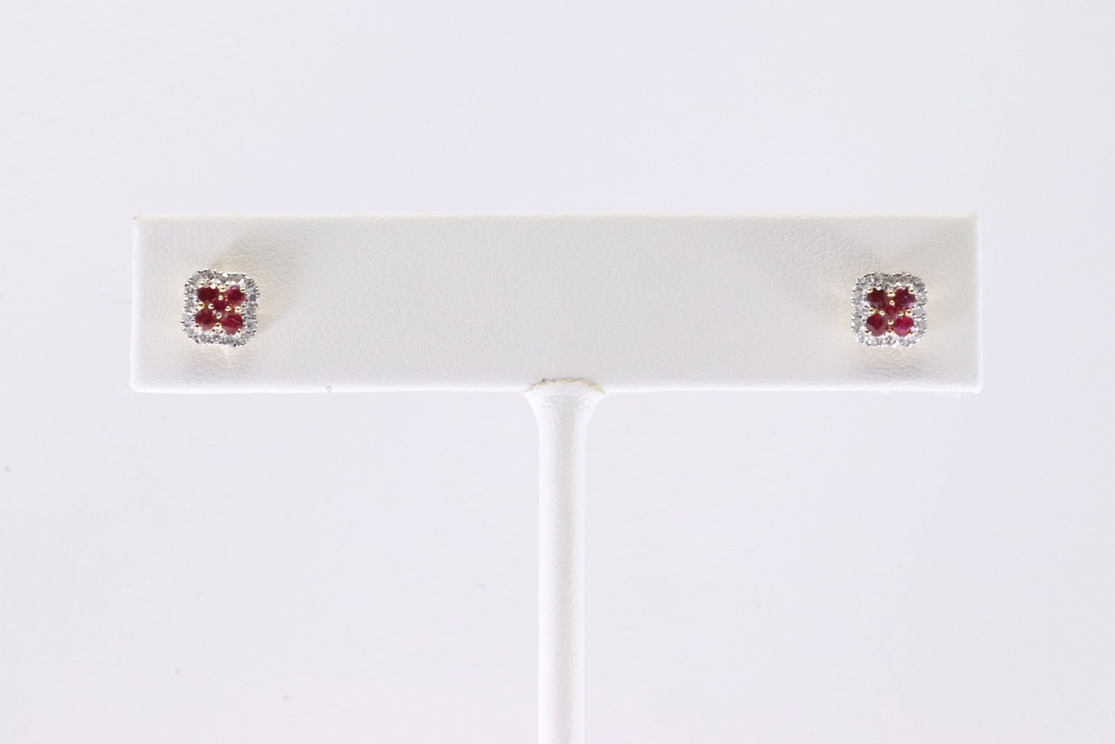 Ruby & Diamond Stud Earring 14Kt.: Ladies 14Kt Yellow Gold Ruby & Diamond Stud Earring. This Charming Earring's has Rubies with Sparkling Diamonds. Diamonds weight: 0.20ctw. Rubies weight: 0.20ctw.