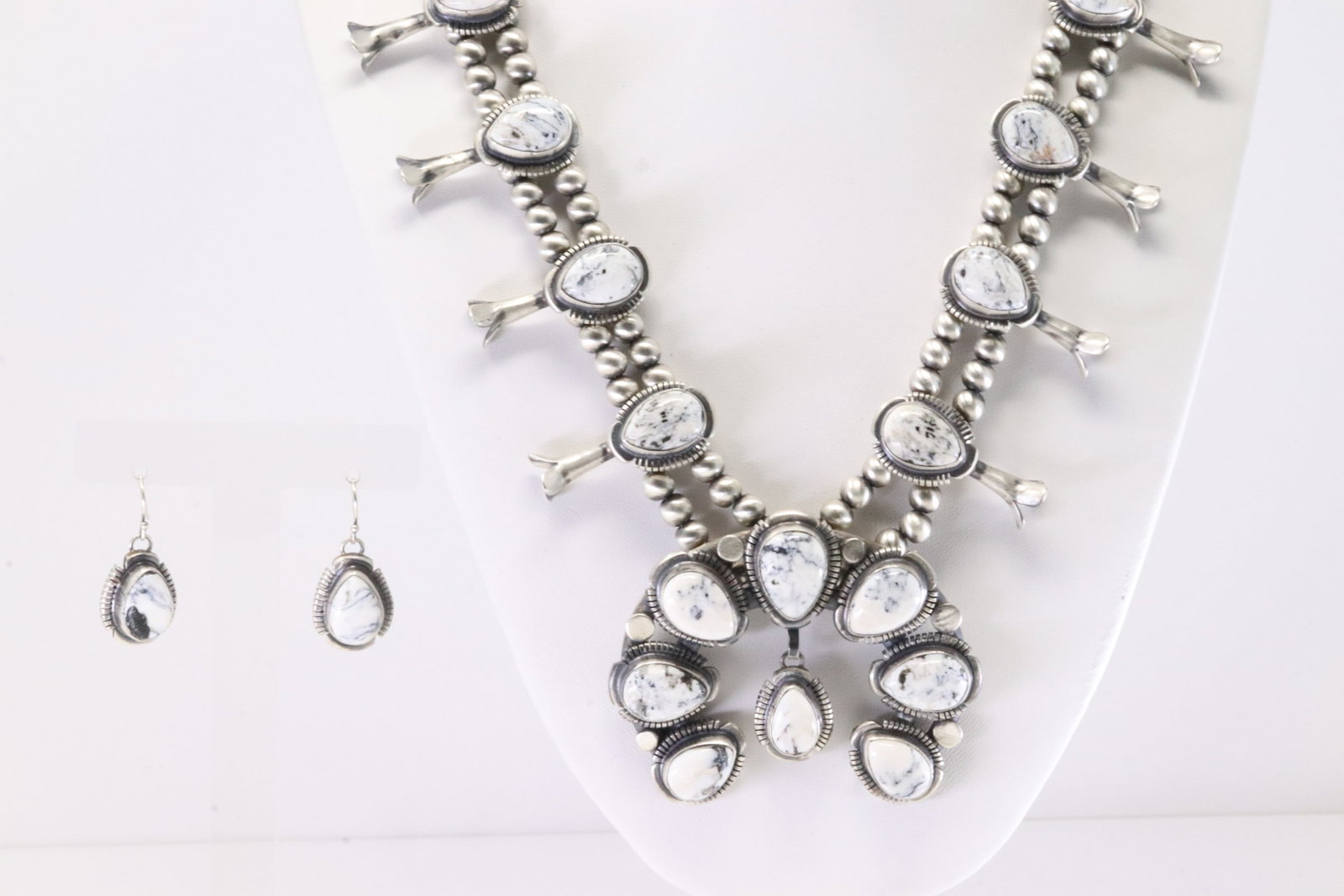Native America Navajo Sterling Silver White Buffalo Squash Blossom Necklace & Earring's Set By: This is a Native America Navajo Sterling Silver White Buffalo Squash Blossom Necklace & Earring's Set By Thomas Francisco. Stamp Thomas Francisco. Necklace Length: 26.00.