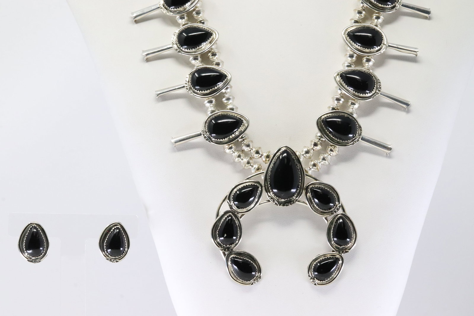 Native America Navajo Sterling Silver White Buffalo Squash Blossom Necklace & Earring's Set By: This is a Native America Navajo Sterling Silver White Buffalo Squash Blossom Necklace & Earring's Set By Thomas Francisco. Necklace length: 28.00"