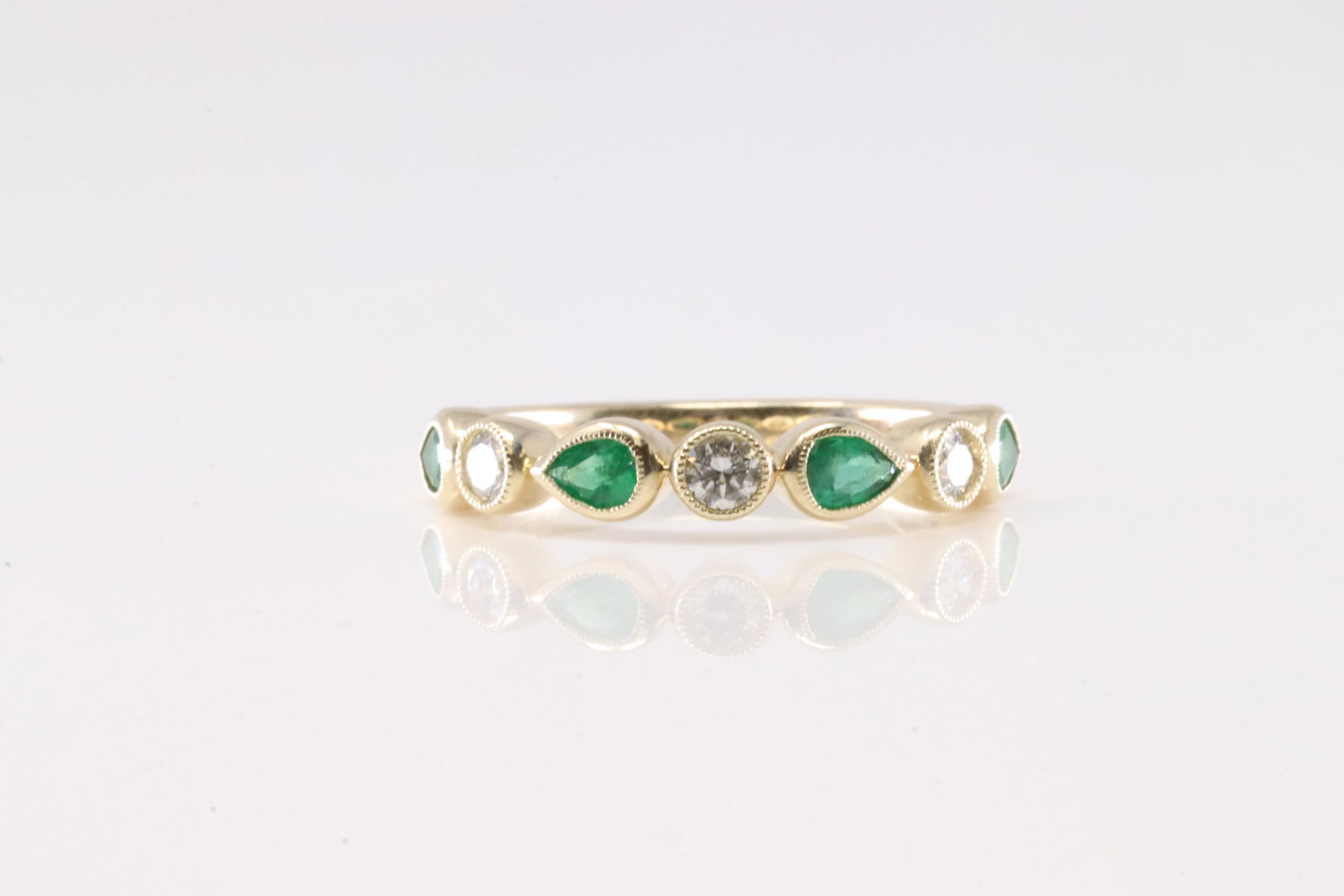 Emerald & Diamond Ring 14Kt.: Ladies 14Kt Yellow Gold Emerald & Diamond Ring. This Charming Ring has 4 Green Pear-Shape Eemralds with 3 Round Diamonds. Diamodns Weight: 0.25ctw. Emeralds Weight: 0.46ctw. Ring Size: 6.50. Total