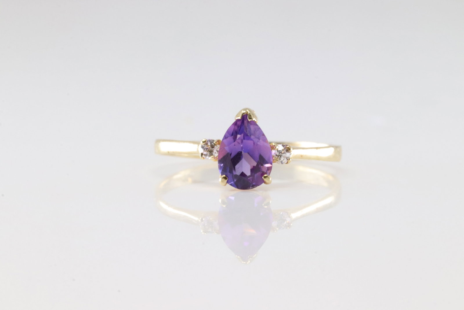 Amethyst & Diamond Ring 14Kt.: Ladies 14Kt Yellow Gold Amethyst & Diamond Ring. This Charming Ring has Tear-Drop Amethyst with 2 Sparkling Diamonds. Ring size: 7.00.