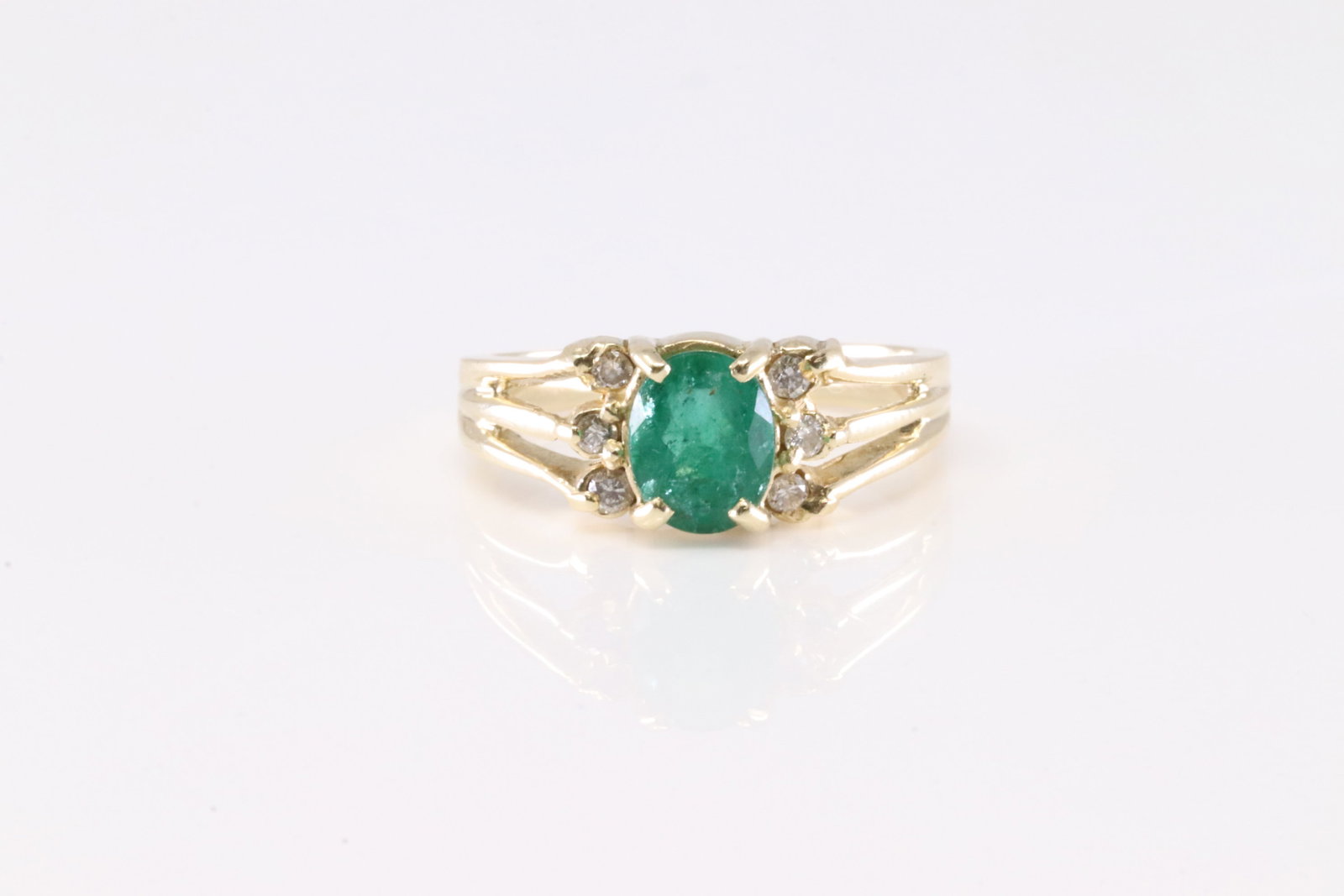Emerald & Diamond Ring 14Kt.: Ladies 14Kt Yellow Gold Emerald & Diamond Ring. This Charming Ring has Green Emerald & 6 Diamonds. Ring size: 6.00. Total weight: 3.75 Grams.