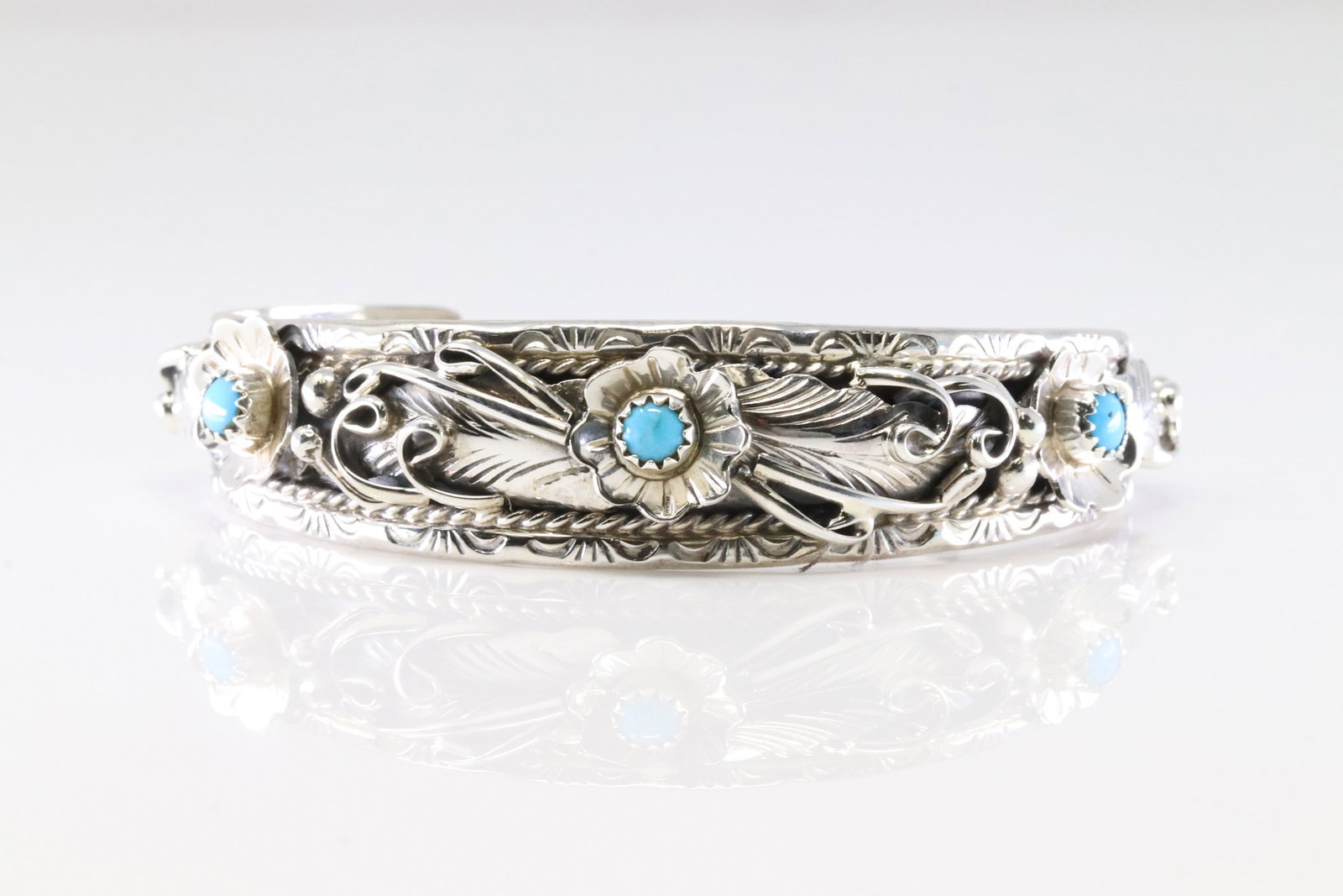 Native America Navajo Sterling Silver Turquooise Bracelet Floral Cuff By Bessi Joe.: This is a Native America Navajo Sterling Silver Turquooise Bracelet Floral Cuff By Bessi Joe.