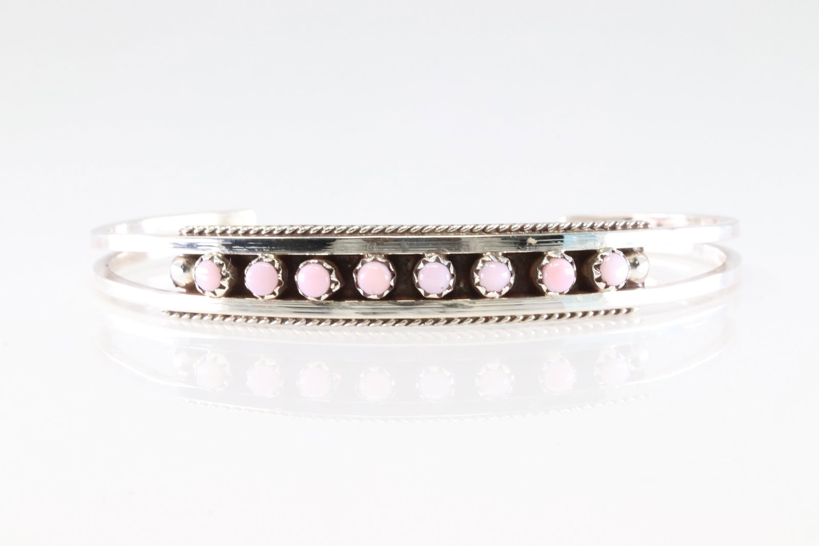 Native America Zuni Sterling Silver Pink Conch Shell Bracelet Cuff By Susie Livingston.: This is a Native America Zuni Sterling Silver Pink Conch Shell Bracelet Cuff By Susie Livingston.