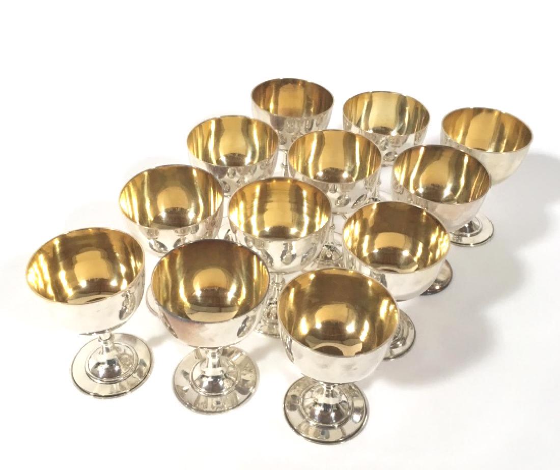 A French Christofle plated set of six wine goblets: With gilt interiors. Height: 4 1/4 in; together with six unmarked copies. (12 items)