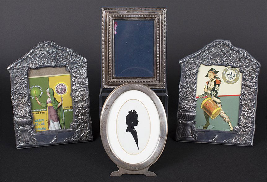 A group of four sterling faced photo frames (1 of 2)