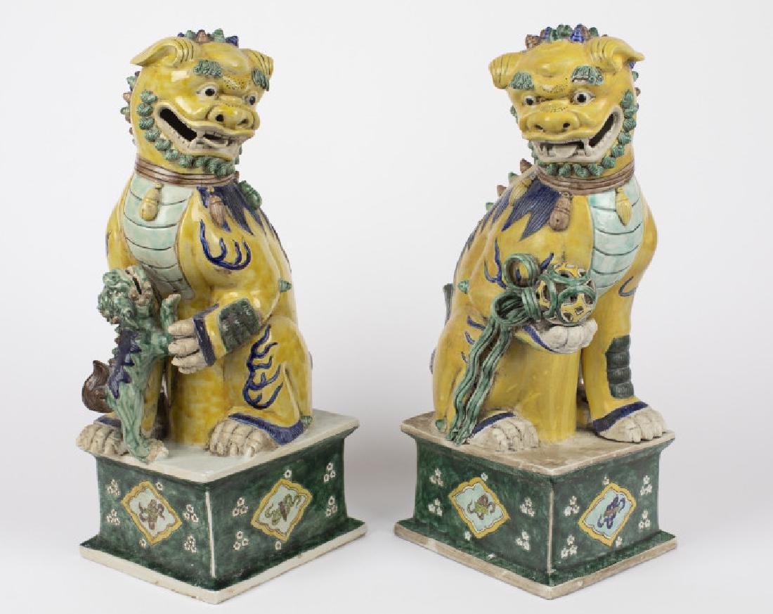 A pair of Chinese ceramic fu dogs (1 of 2)