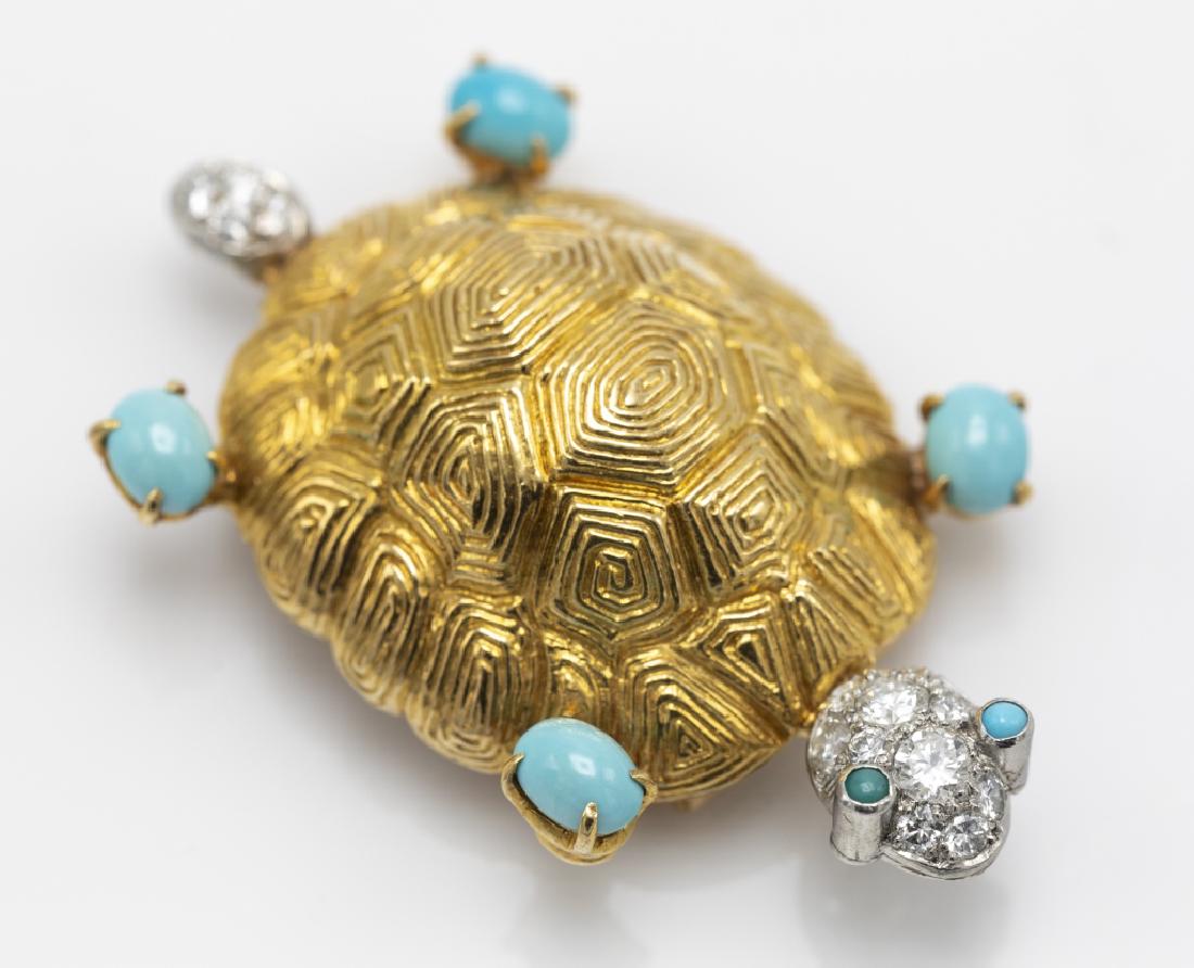 A Van Cleef & Arpels diamond, turquoise, 18k pin: Designed as a turtle, accented with fifteen round brilliant-cut diamonds weighing a total of approximately 0.50 cttw., further accented by six turquoise cabochons, set in a textured 18k yellow gold mo