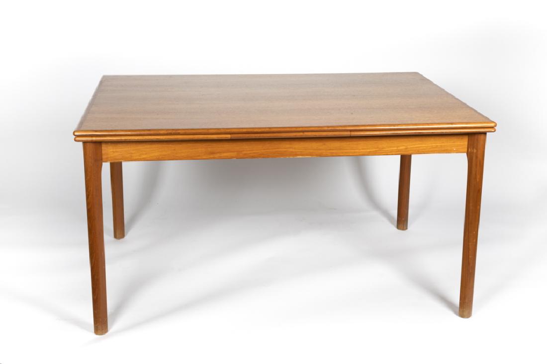 A Danish Modern extension dining table: Last half 20th century. By Ansager Mobler. 29in. H x 371/2in. W x 55in. L (non extended)