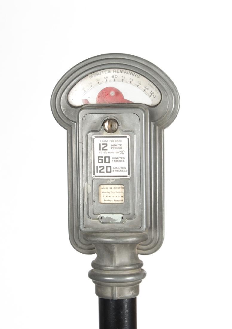 A vintage parking meter on stand