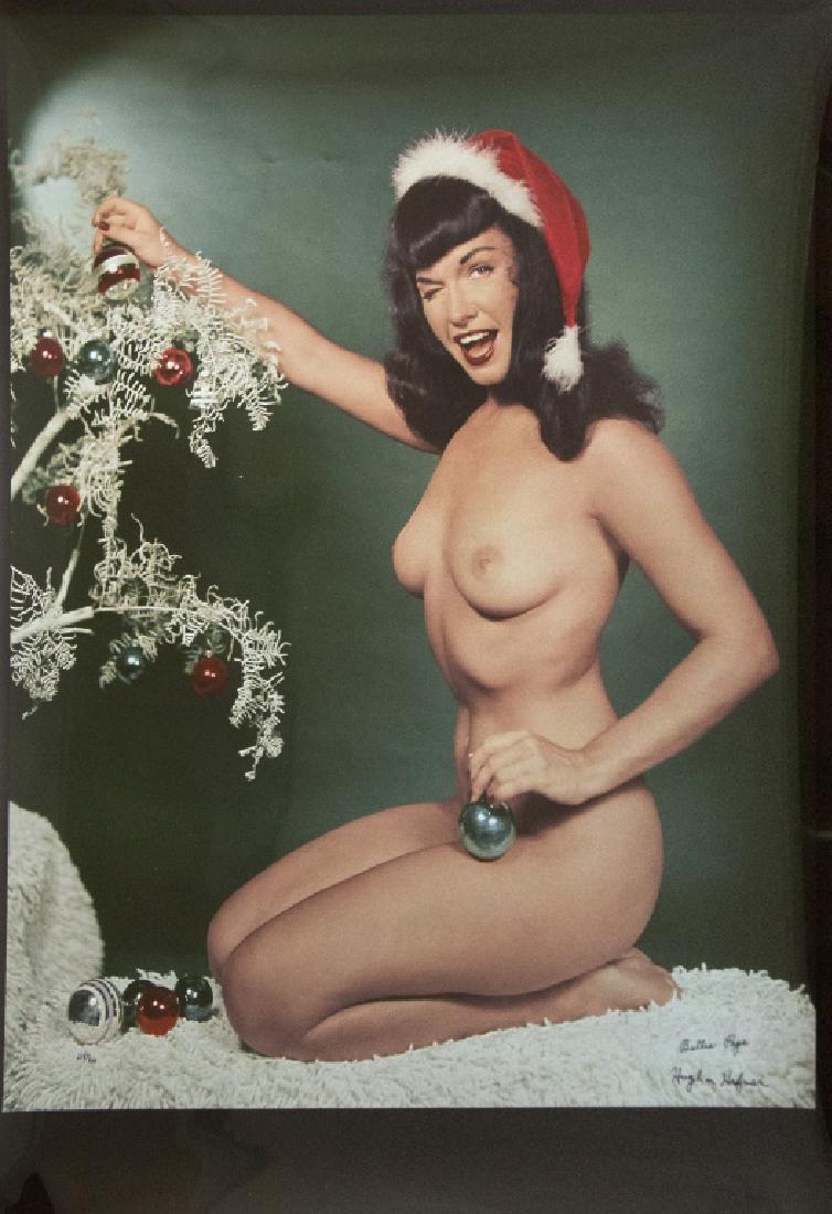 A Bettie Page and Hugh Hefner autographed poster: Bettie striking a coy pose in a 1955 centerfold, printed on photographic paper, signed 'Bettie Page' and 'Hugh M Hefner' and numbered 218/750. Unframed: 35in. H x 26in. L