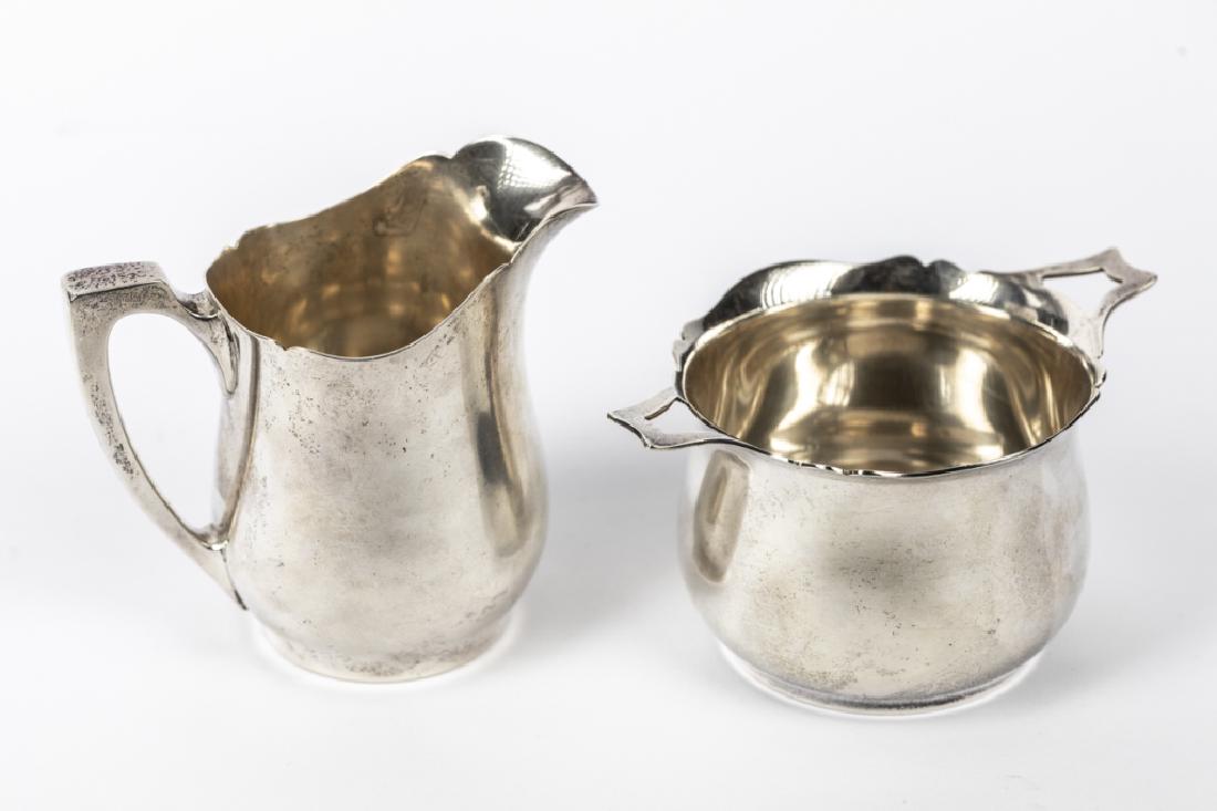 A Wallace sterling cream & sugar set: Wallace Silversmiths Inc. Wallingford, CT, # 3645, comprising: cream pitcher and open sugar bowl. 4in. H [10.24 oz. t.] [318.6 g.] (2 pieces)