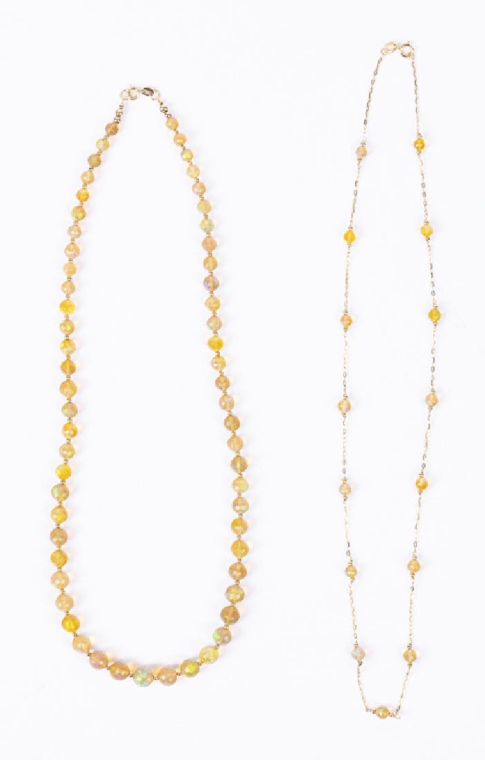 A collection of two opal, 14k necklaces (1 of 3)