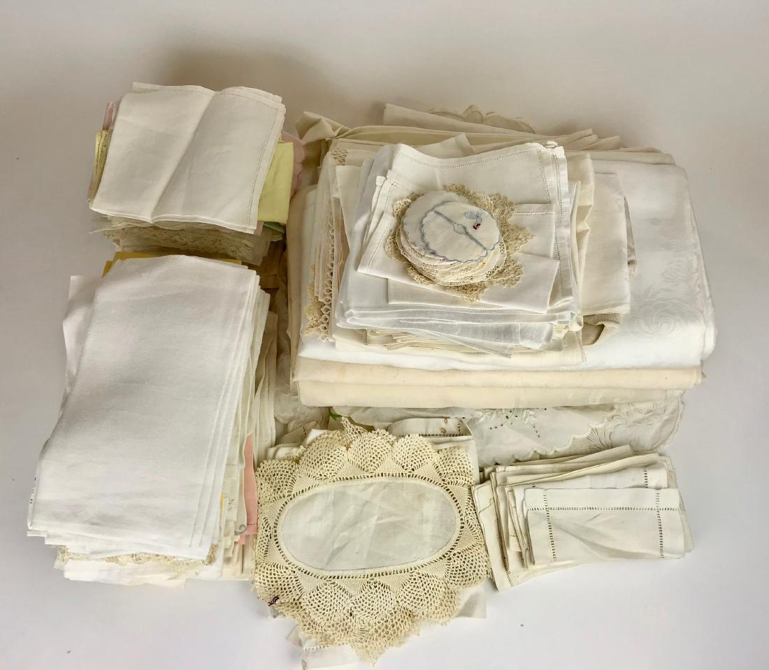 A large group of linens including napkins, cocktail: Various ages and sizes.