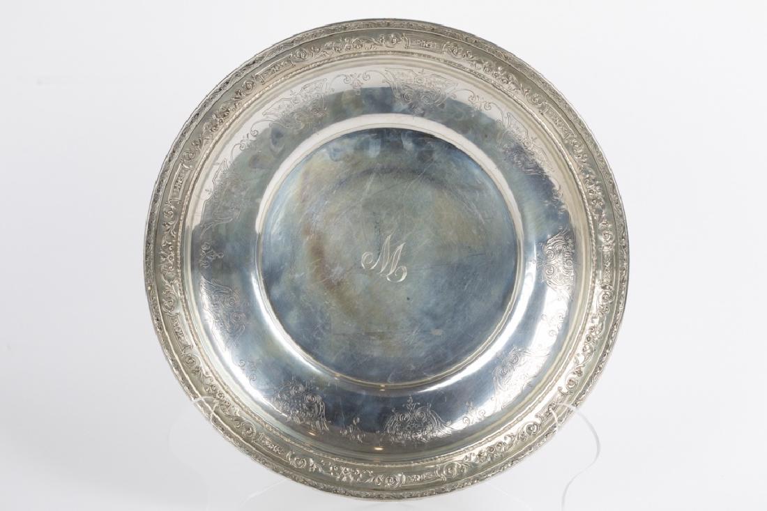 A sterling bowl by Wallace: Wallace Silversmiths, Inc., Wallingford, CT, # 3821-9, monogrammed: W. 1 1/2in. H x 14in. Diameter. [25.03 oz. t.] [778.6 g.]