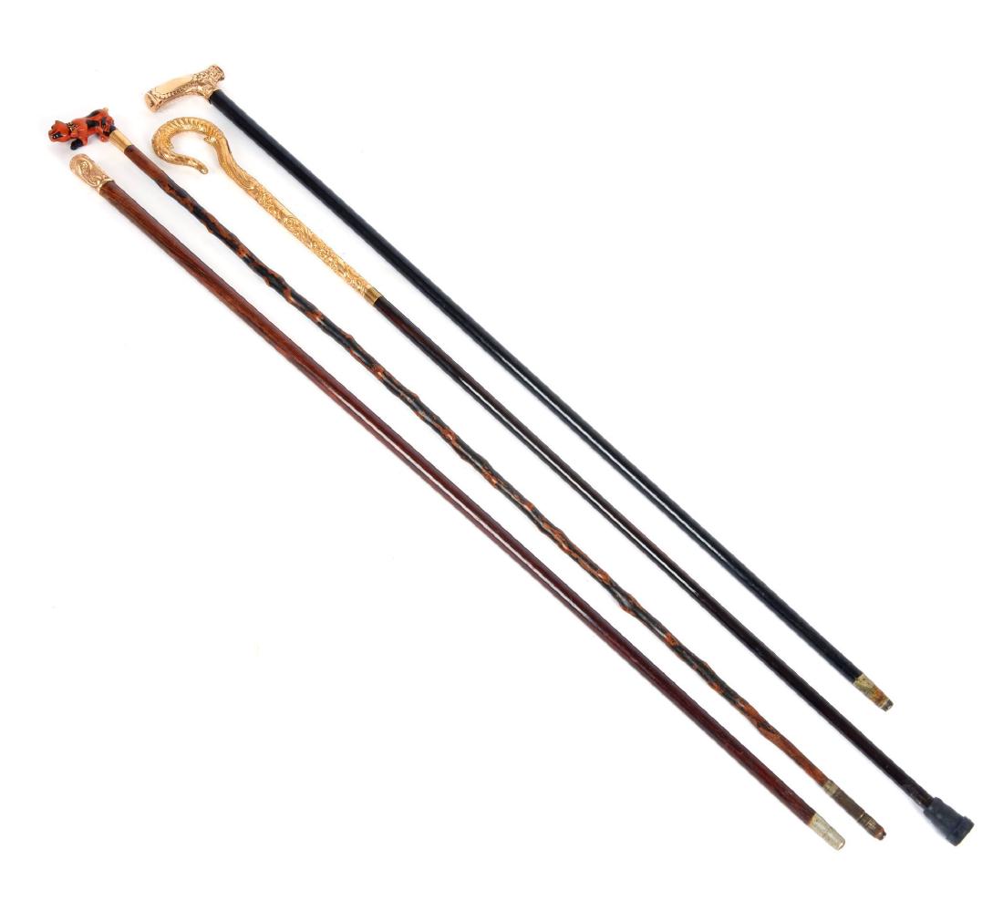 A group of four gold plated canes (1 of 3)