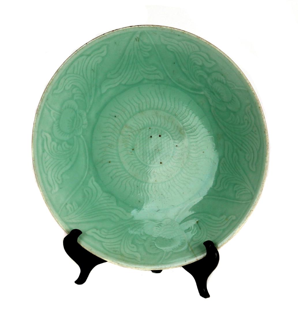 A Chinese celadon glazed 'lotus' dish (1 of 4)