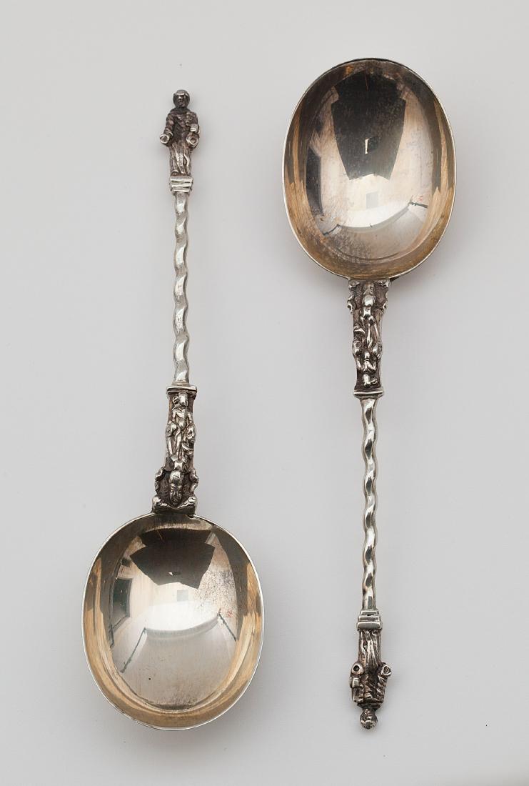An Edward VII silver pair of Apostle berry spoons (1 of 5)