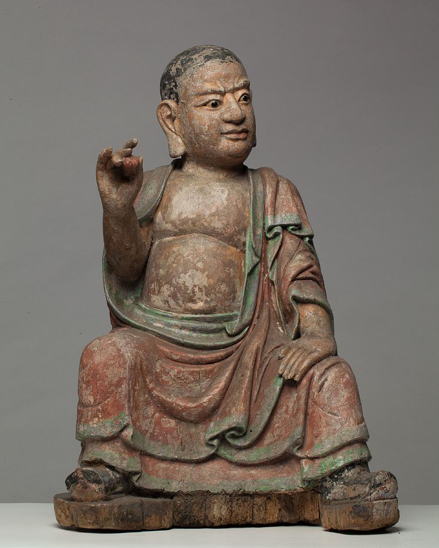 A large Chinese polychrome lacquered wood luohan figure (1 of 5)