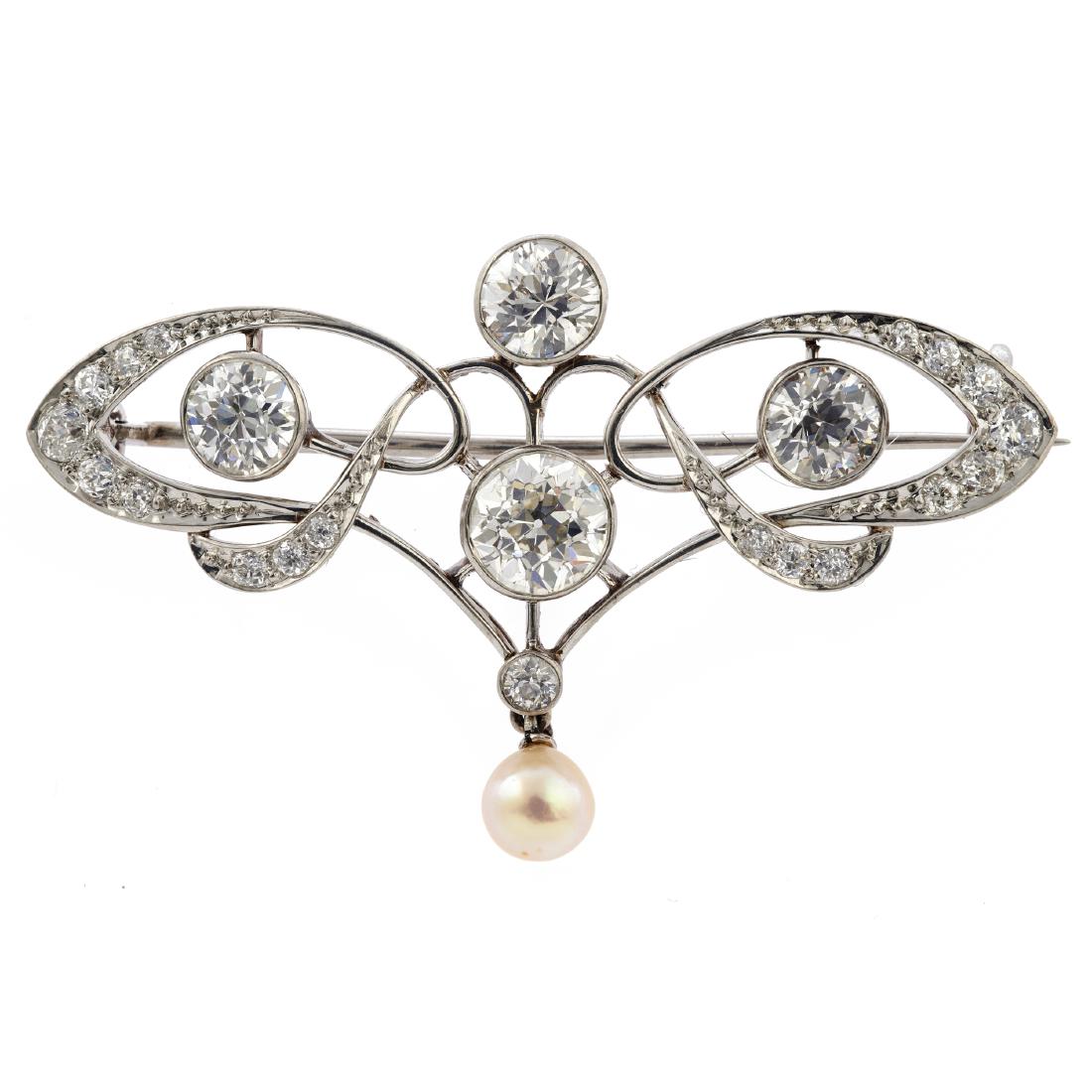 An Edwardian diamond, cultured pearl, platinum brooch: Featuring four European-cut diamonds weighing a total of approximately 2.09 cttw., accented by nineteen old European-cut diamonds weighing a total of approximately 0.47 cttw., highlighted by an a