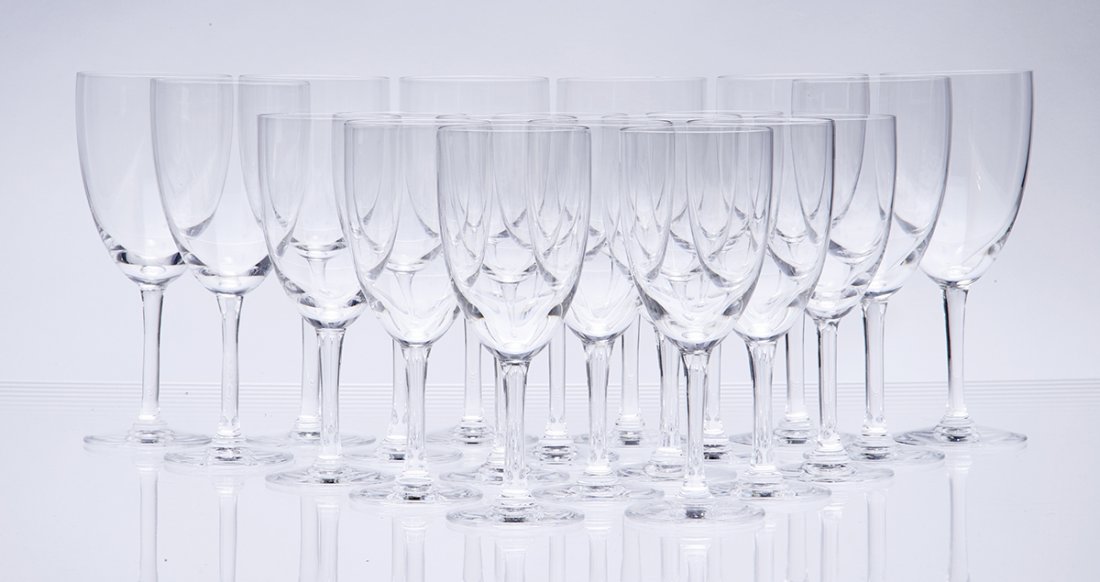 Group of Lalique crystal stemware: In the France pattern, comprising eight water goblets with twelve wine glasses, tallest 7 1/8 in. (17 cm) height Condition: Overall good condition with no apparent chips or breaks.