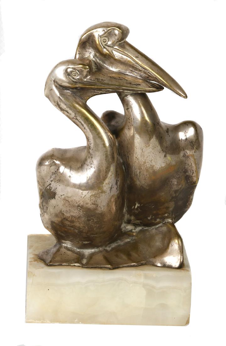 A. Kelety (1874-1940): Aexandre Kelety, (French/Hungarian D. 1940) Silvered bronze statue of pelican pair rising on a white onyx plinth, incised signature on foot 14 in. (34 cm.) high.