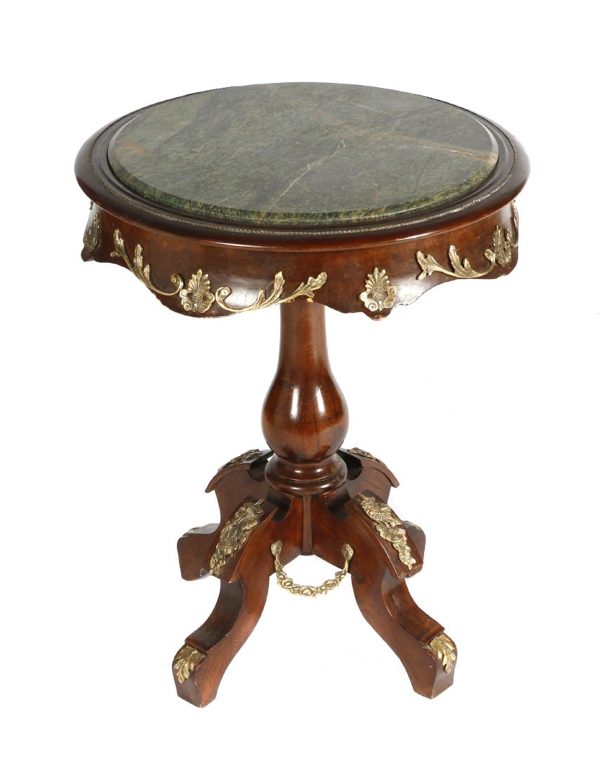 Empire style gilt bronze mounted gueridon: The circular top with variegated green marble raised on gilt foliate legs. 30in. H x 23in. Diameter