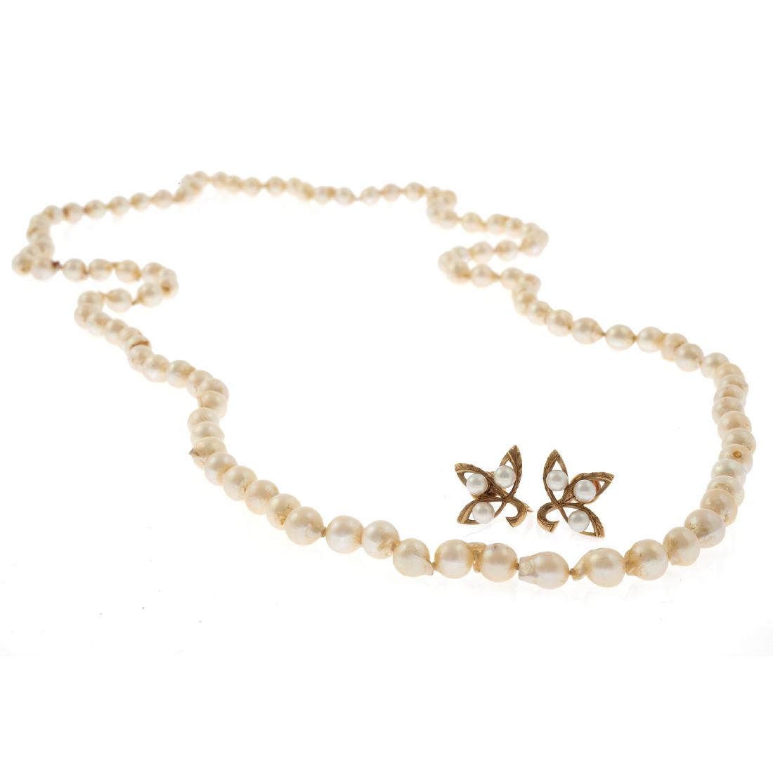 A cultured pearl necklace and pair of 14k Mikimoto: Composed of one hundred-seven baroque pearls measuring approximately 7.5 to 7.0 mm forming a 36 inch necklace; together with a pair of earrings, each featuring three round cultured pearls set in a 14k