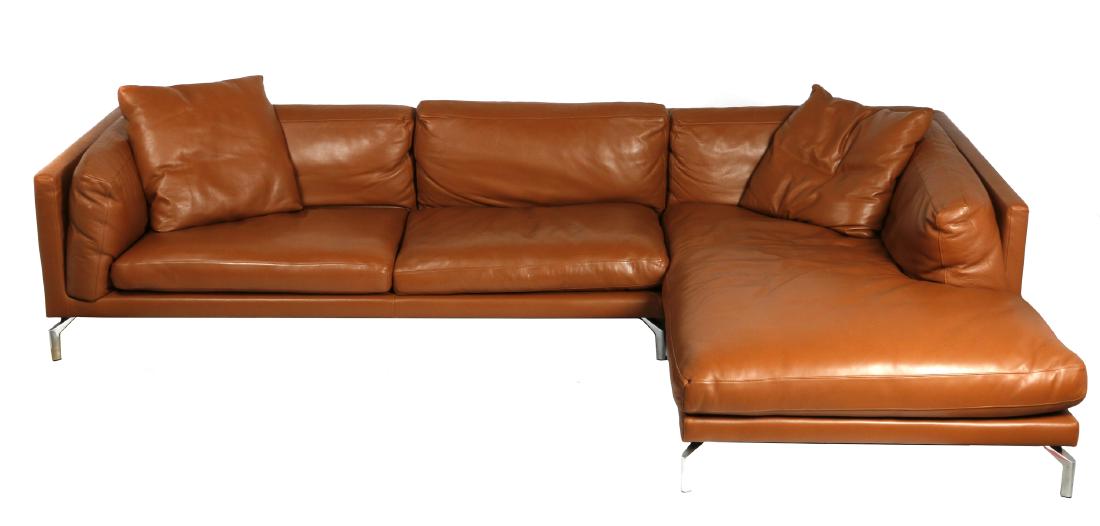 Giorgio Soressi for DWR leather sectionals: Circa 2007, the "Como" sectional comprises a chaise with a single cushion and a love seat with two cushions, executed in Kalaha