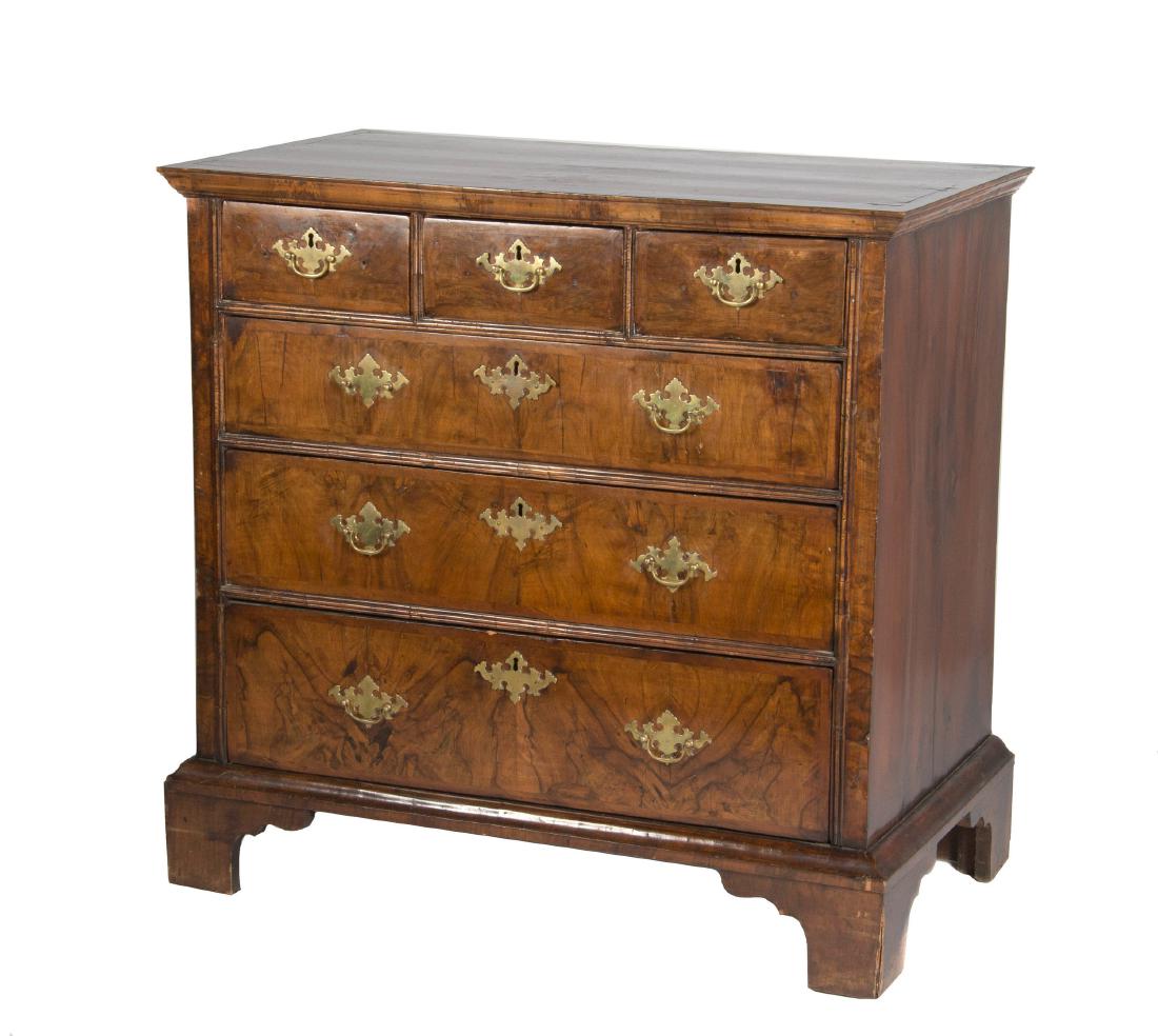 George III chest of drawers: Fourth quarter 18th century. The herringbone and cross banded inlaid mahogany top over three short and three graduated long drawers ending in bracket feet. height 38in. (97cm); width 40in. (102c