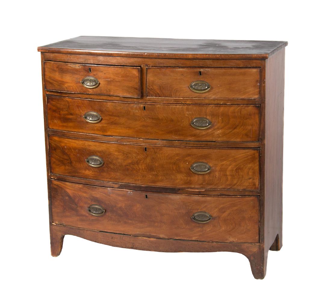 A George III mahogany chest of drawers: Fourth quarter 18th century. The bowfront top over a conforming mahogany case with two short over three graduated long drawers ending on French feet. height 38in. (97cm); width 41in. (104cm); depth 