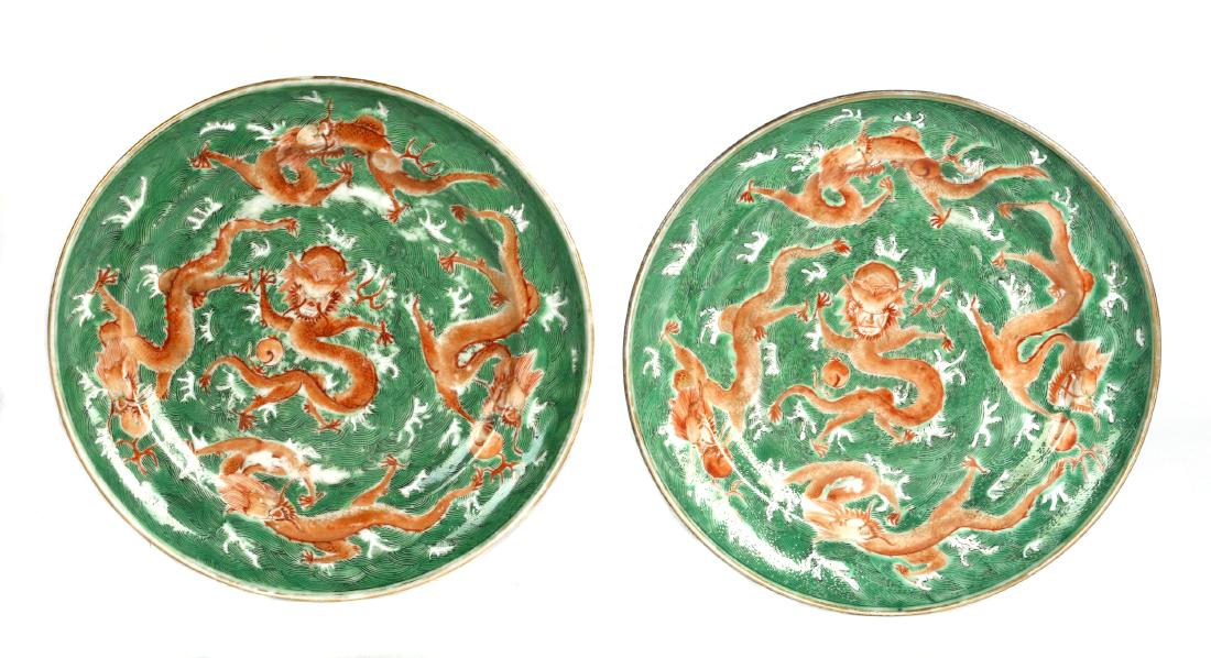 A pair of Chinese iron-red painted 'dragon' dishes (1 of 4)