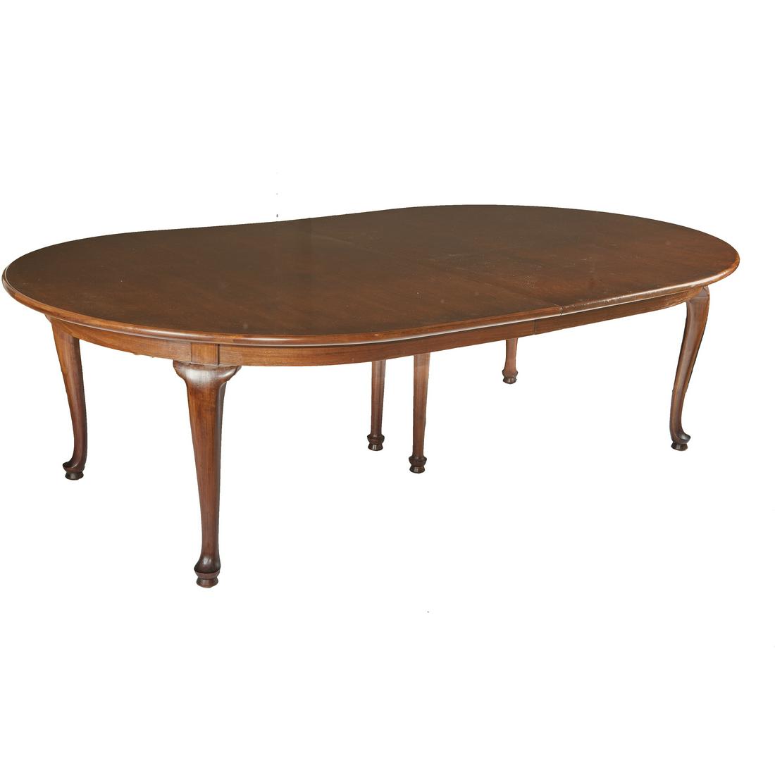 Queen Anne style dining table: The finely figured oval mahogany top raised on cabriole legs. 30in. (76cm) height; (60in. 153cm) width; 100in. (2.5m) length with three leaves, each 20in. (51cm) length