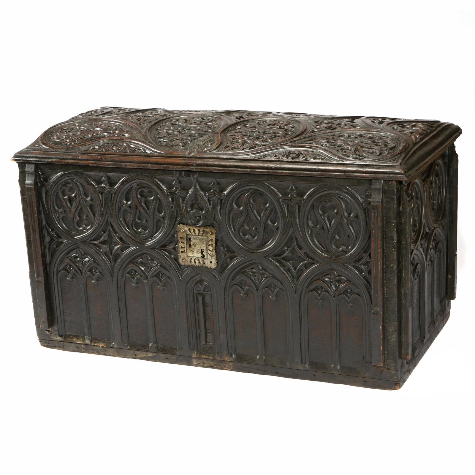Gothic Revival Coffer: 19th Century. The slightly domed lid carved on the underside with shield charged with addorsed phoenix and battlement, the case overall carved with trefoil and quatrefoil above a band of lancet arches