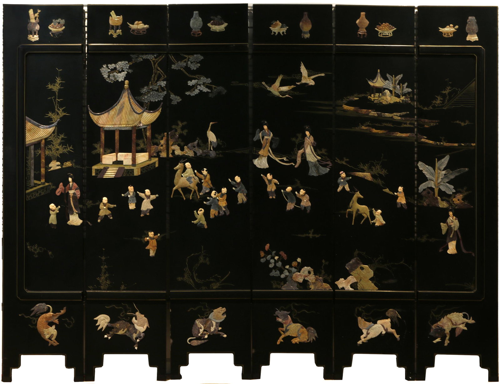 Six-Panel Folding Screen with Soapstone Inlay, 20th: The front side depicting maidens and children at leisure in a garden, the reverse with gilt painted roundels. 72 x 107 1/4 inches